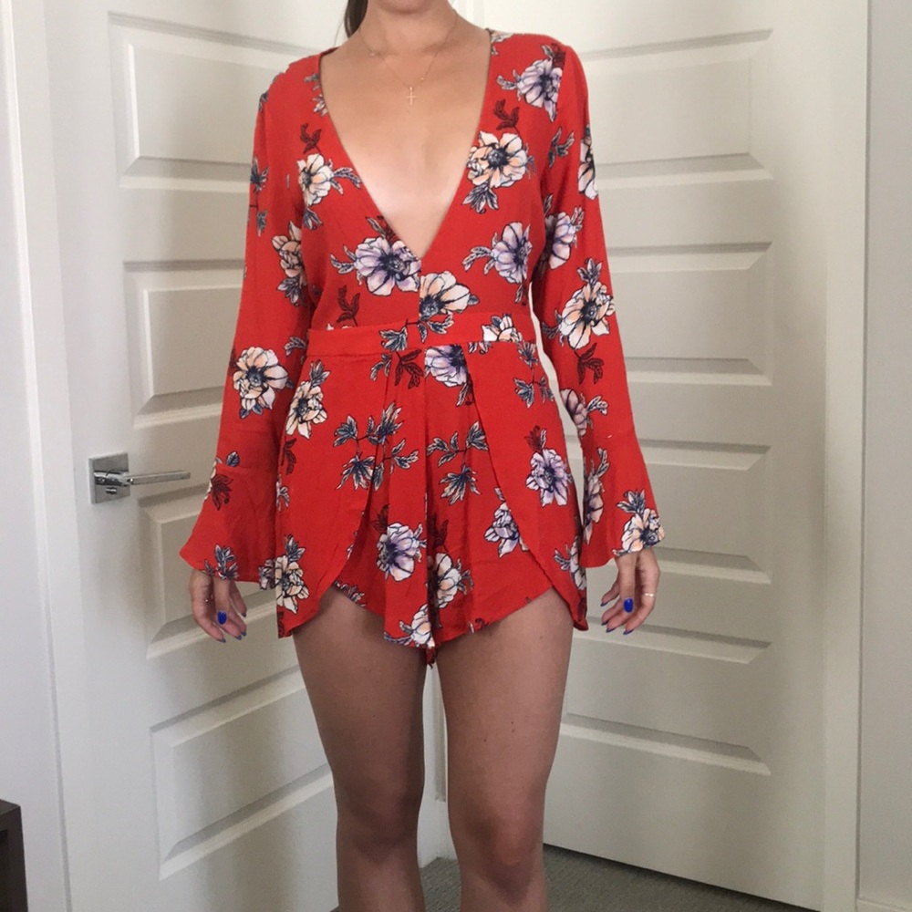 Misguided red romper with plunging neckline